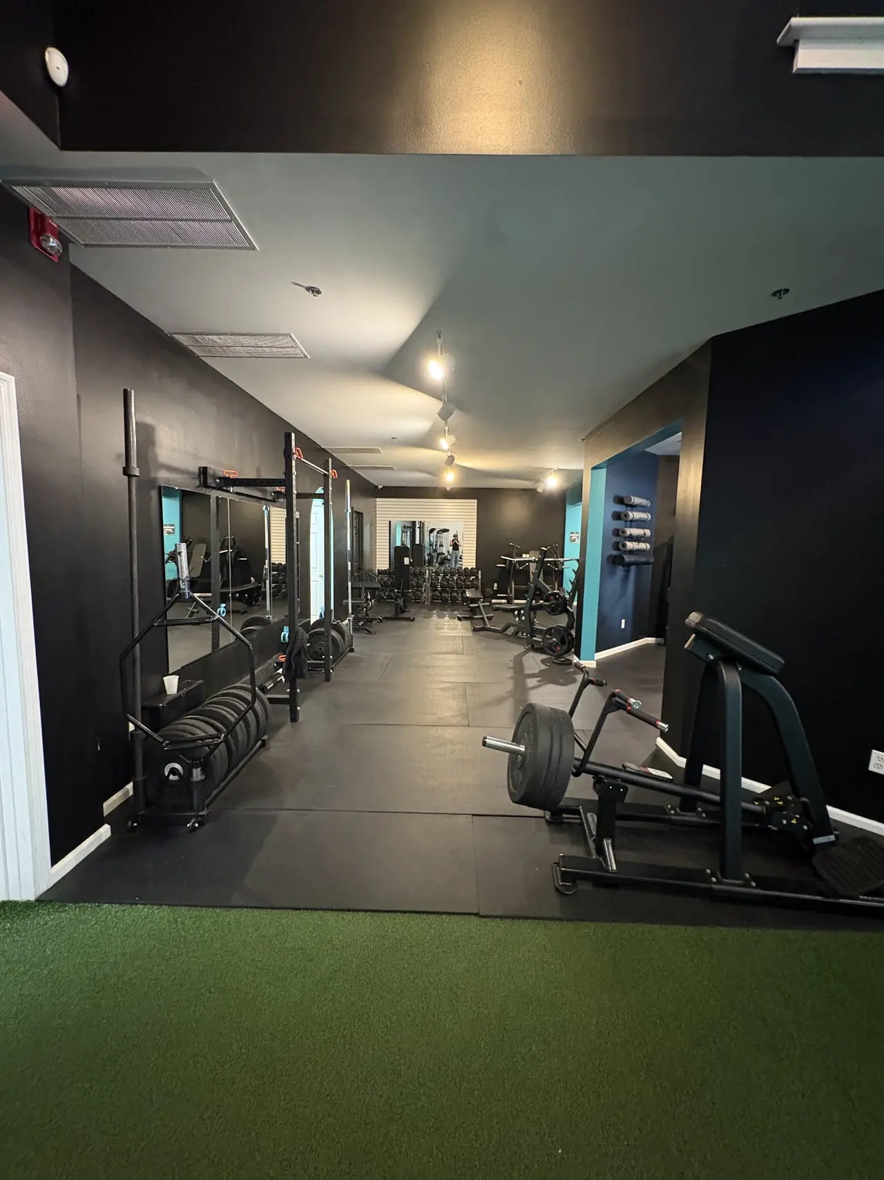Strength floor with racks and mirrors at the current GSS club